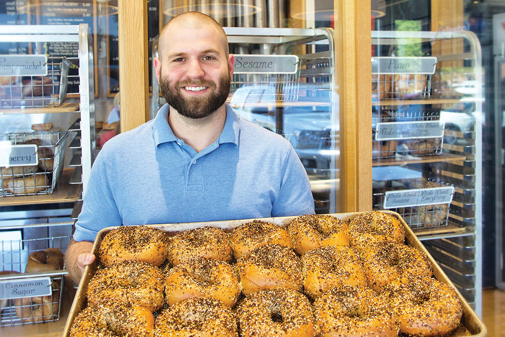 Chris Wietecha, owner of Providence Bagel, proudly displays The Everything